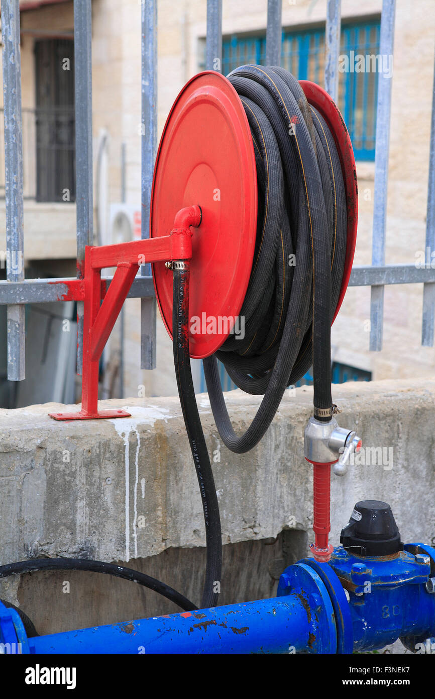 fire hose reel at industrial building in Beit Shemesh, nearby Jerusalem, Israel Stock Photo