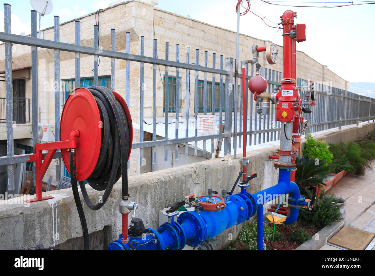 fire sprinkler system and hose reel at industrial building in Beit Shemesh, nearby Jerusalem, Israel Stock Photo