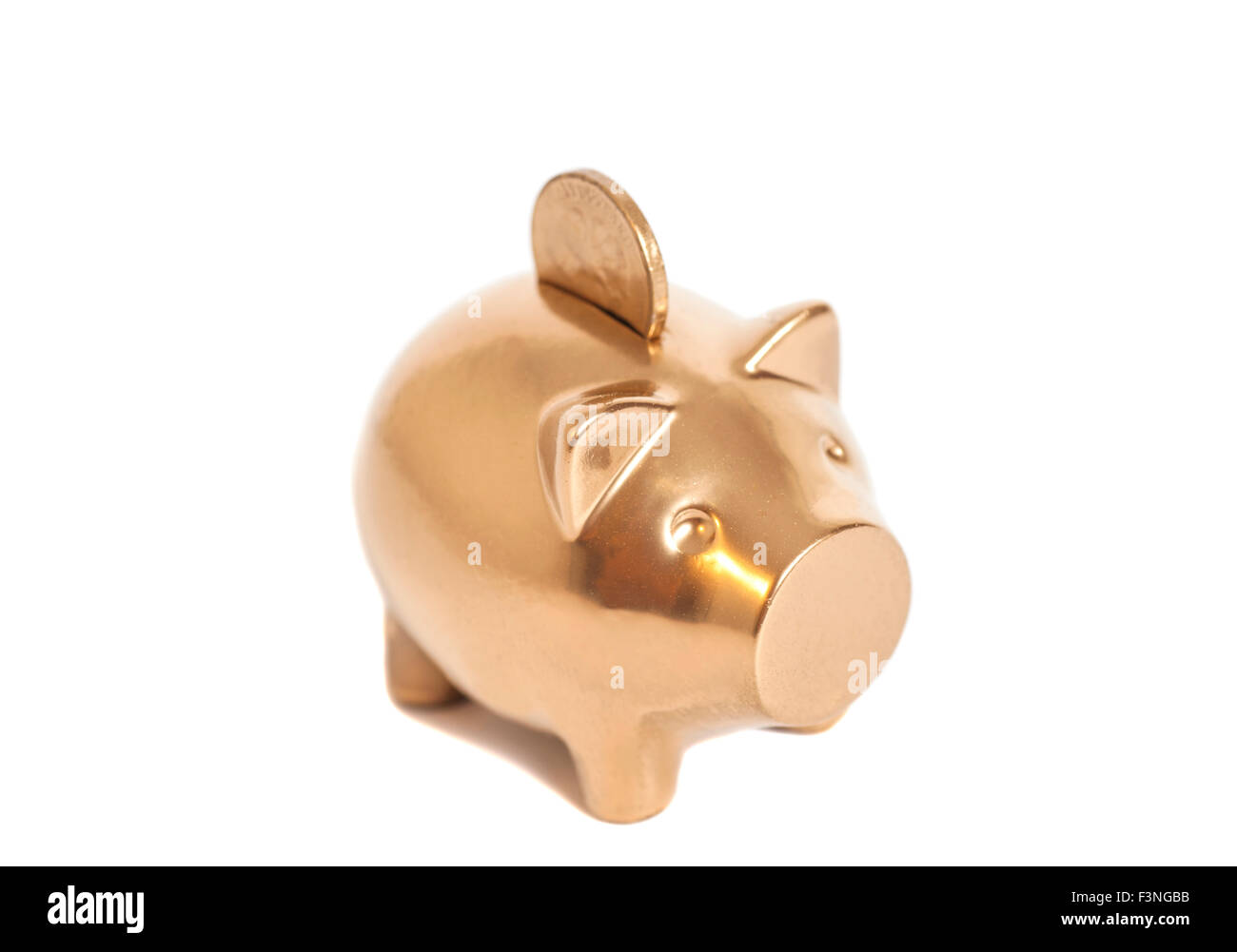 Golden piggy bank with coin isolated on white Stock Photo - Alamy