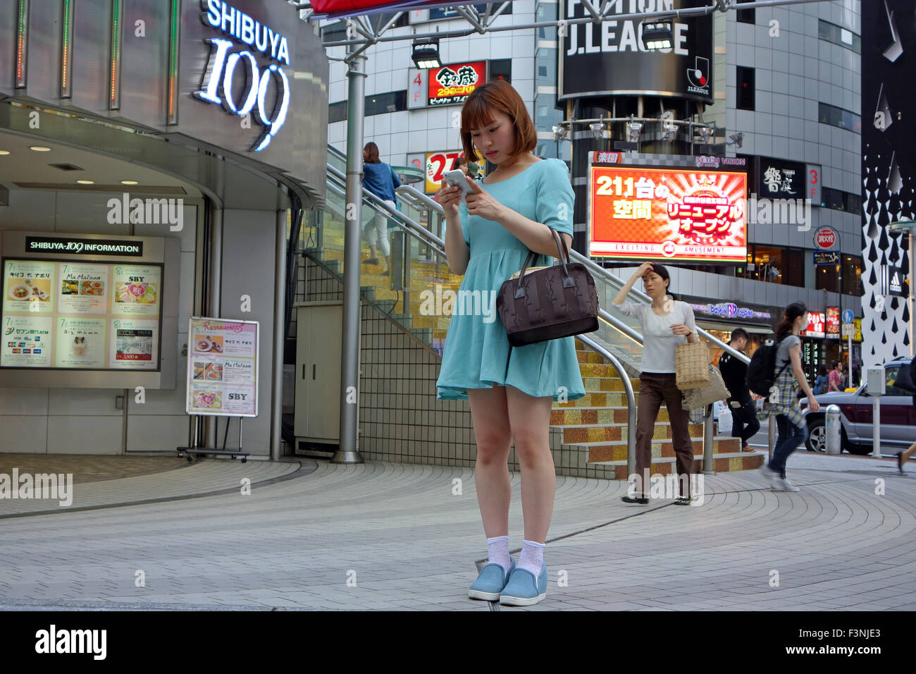 Fashionable young Japanese women outside the department store Shibuya 109 in Shibuya, Tokyo, Japan. Stock Photo