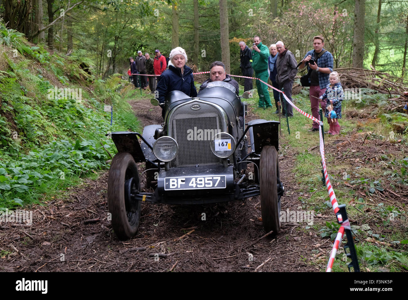 New Radnor, Powys, Wales - Saturday 10th October 2015 - The Vintage Sports Car Club ( VSCC ) hill climb trial challenge on The Smatcher a steep wooded hill just outside New Radnor. This Welsh Trial has been running since 1939. Competitors score points the further they drive up the steep hill with 25 points being awarded for reaching the top. The passengers act as 'bouncers' who bounce to help the car grip on the steep sections. Shown here is a 1930 Ford Model 'A' Special. Stock Photo