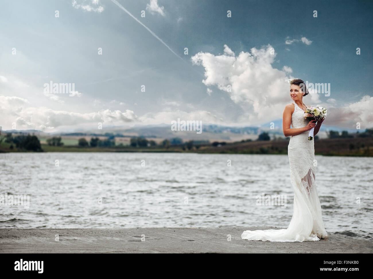 Bride At The Lake Stock Photo - Alamy