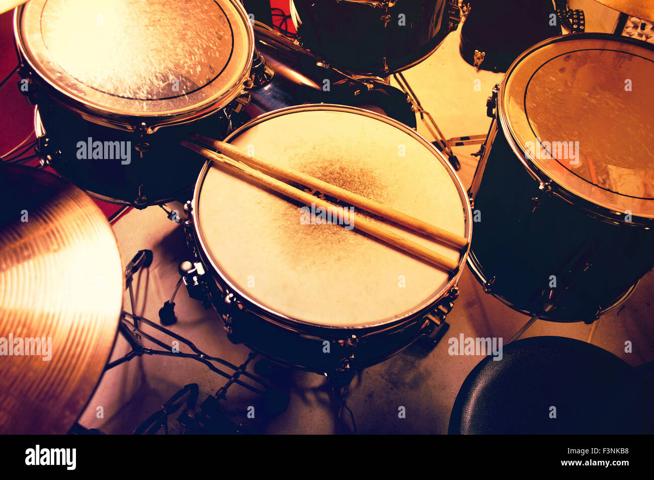 Drums conceptual image. Picture of drums and drumsticks lying on snare