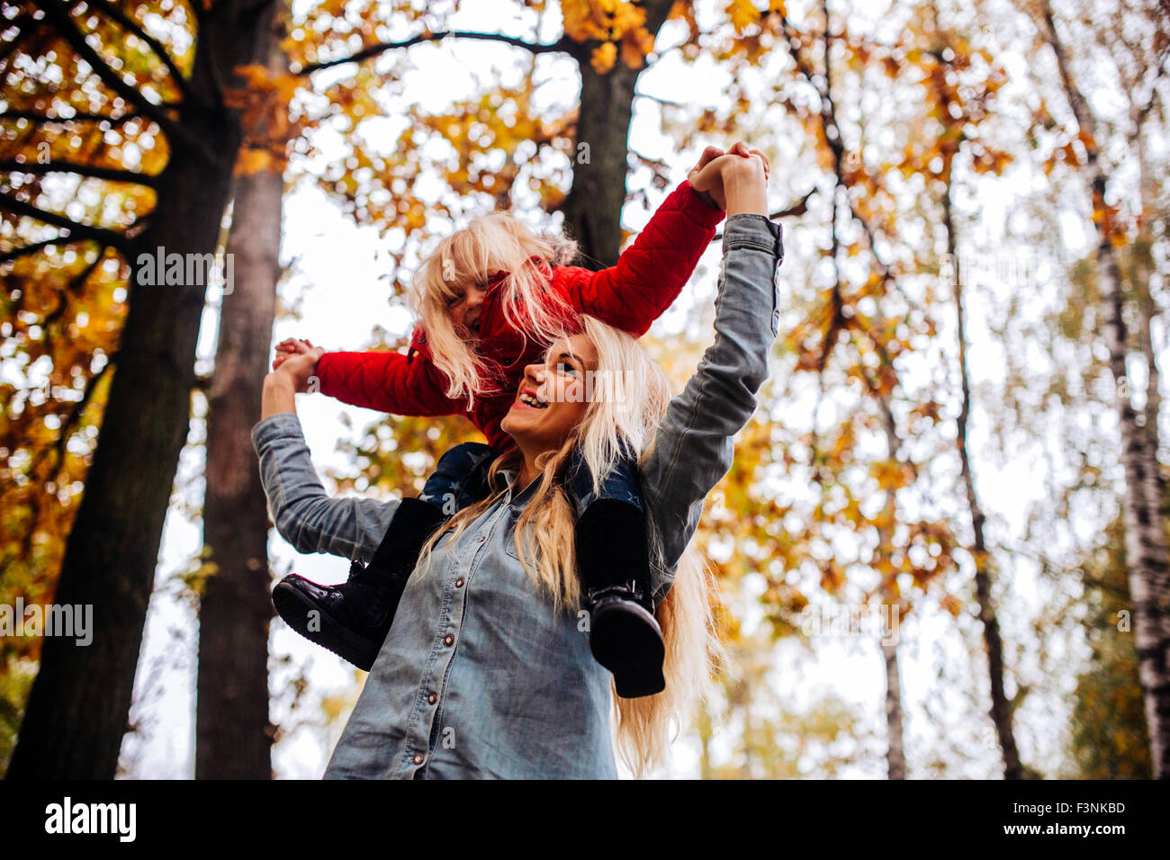 Mother with daughter in autumn park Stock Photo - Alamy