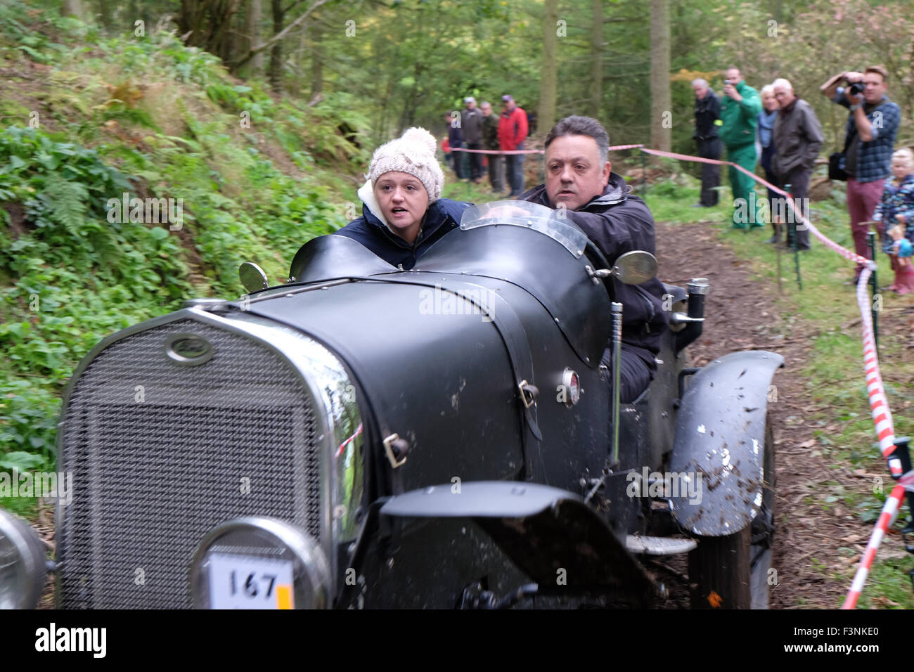 New Radnor, Powys, Wales - Saturday 10th October 2015 - The Vintage Sports Car Club ( VSCC ) hill climb trial challenge on The Smatcher a steep wooded hill just outside New Radnor. Competitors score points the further they drive up the steep hill with 25 points being awarded for reaching the top. The passengers act as 'bouncers' who bounce to help the car grip on the steep sections. Shown here is a 1930 Ford Model 'A' Special. Stock Photo