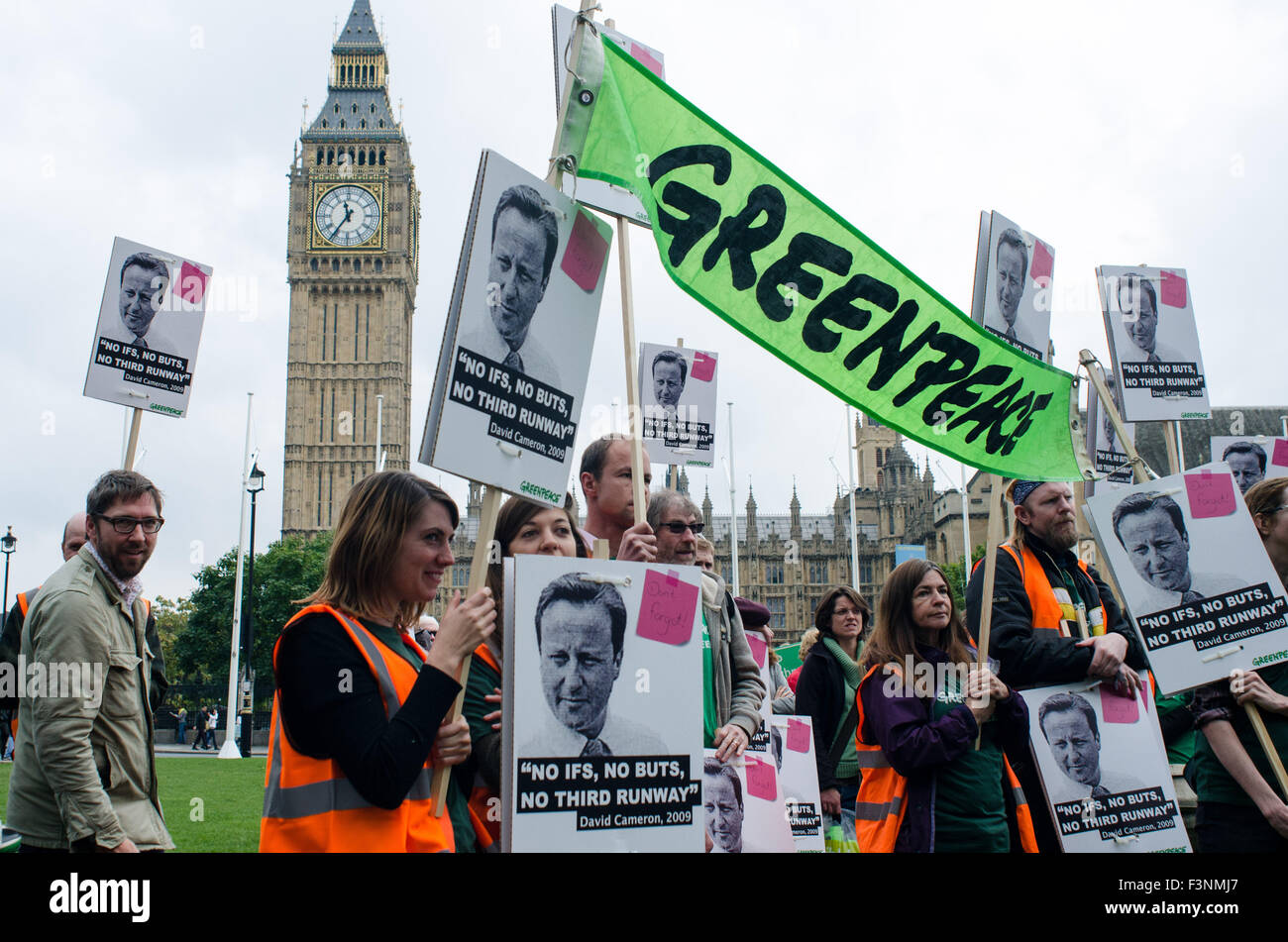 London, UK. 10th Oct, 2015. Greenpeace protesters gather in Parliament Square, London. They are protesting against the proposal of a third Runway at Heathrow airport. Credit:  Bertie Oakes/Alamy Live News Stock Photo
