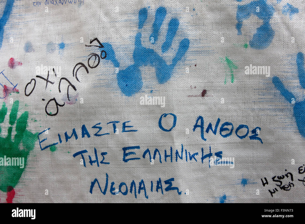 Hand prints on canvas and ink marker slogans wrote by people reading