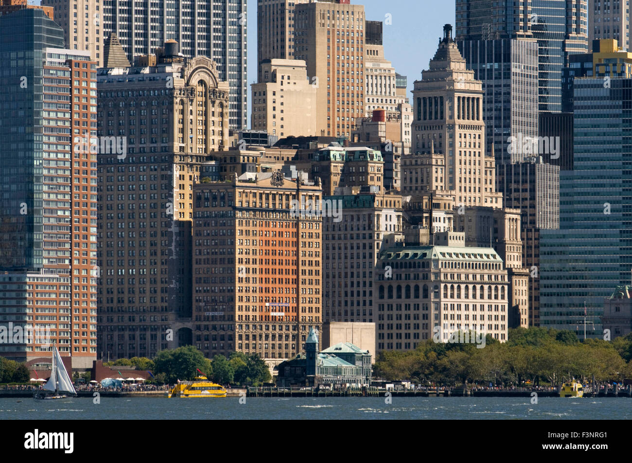 Huge skyscrapers waterfront from Battery Park and Pier A. Pier A in Battery Park is a building built in 1886 by the Department o Stock Photo