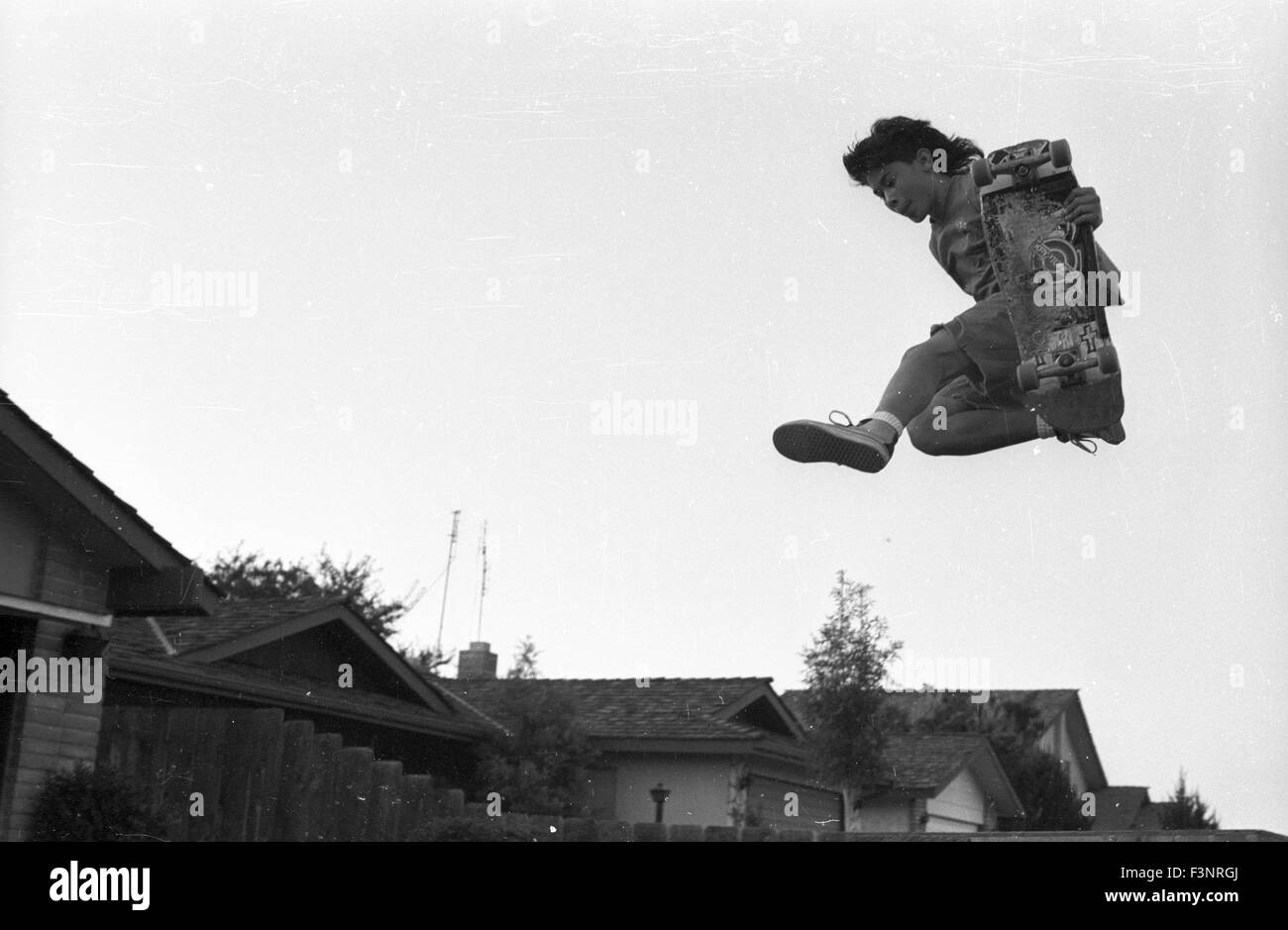 Jumping off a jump ramp in suburban neighborhood Stock Photo Alamy