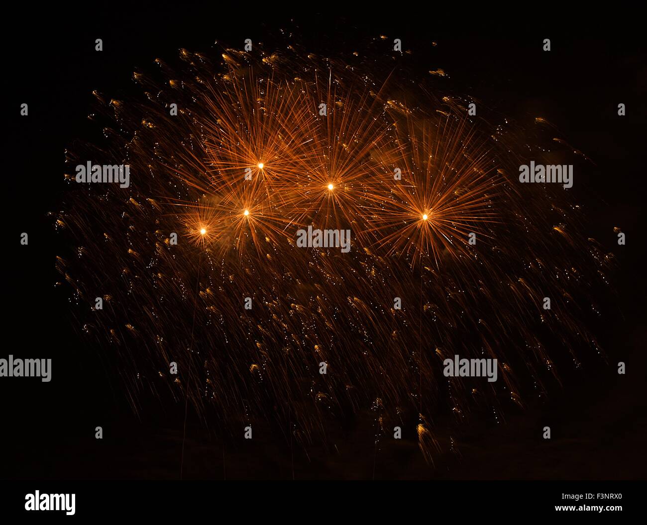 Amazing colourful fireworks explosion isolated in dark background, red