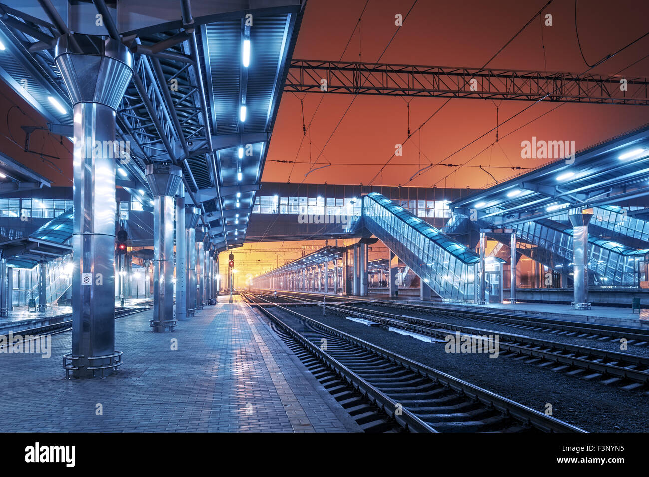 Cargo train platform at night. Railroad in Ukraine. Railway station Stock Photo