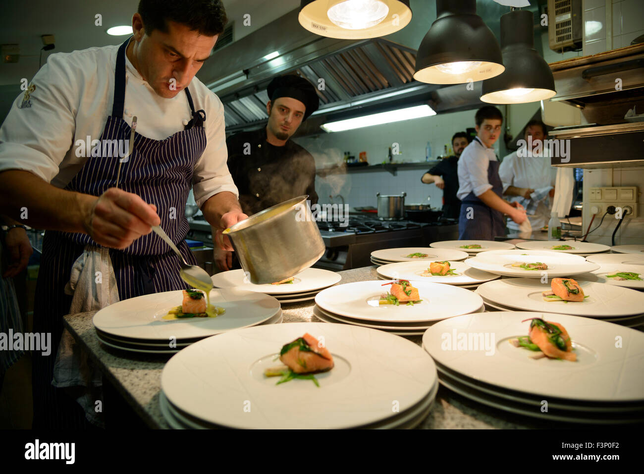 Portuguese chef Ricardo Costa plating gourmet food Stock Photo