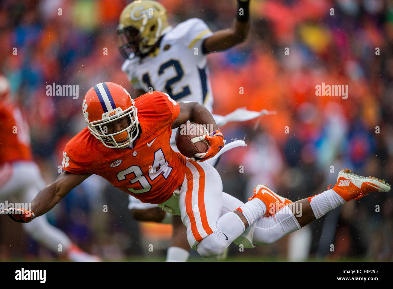 Clemson wide receiver RayRay McCloud (34) is tripped up during the