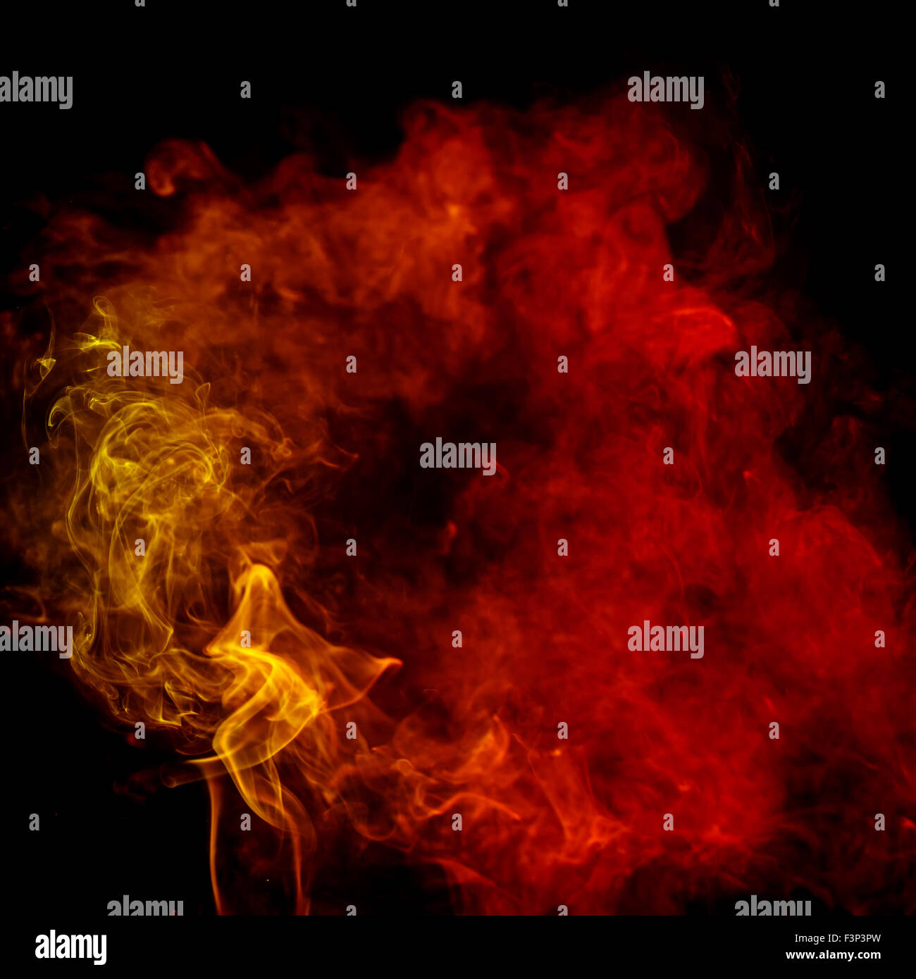 Abstract art. Colorful red and orange smoke from the aromatic sticks on