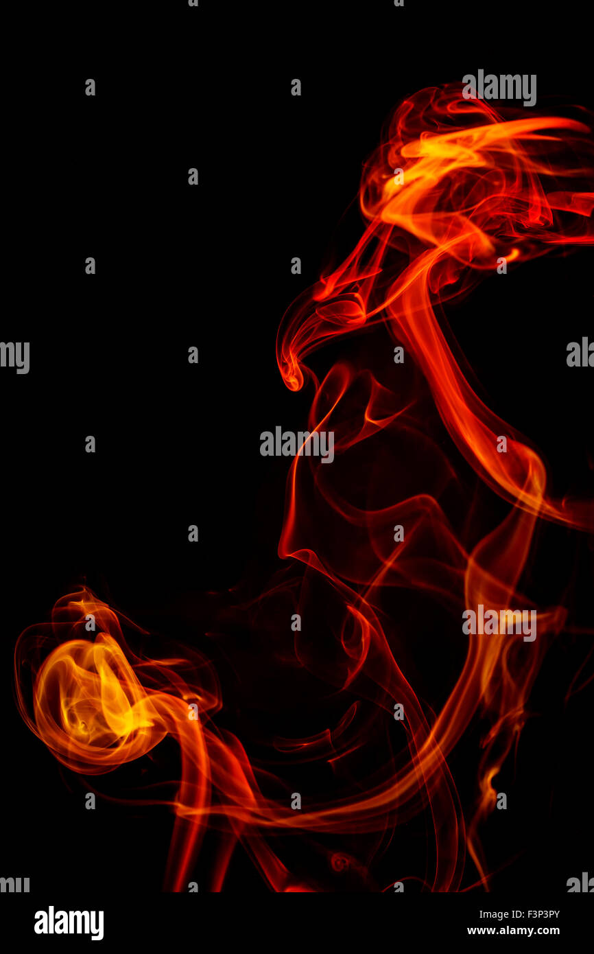 Abstract art. Colorful red and orange smoke from the aromatic sticks on