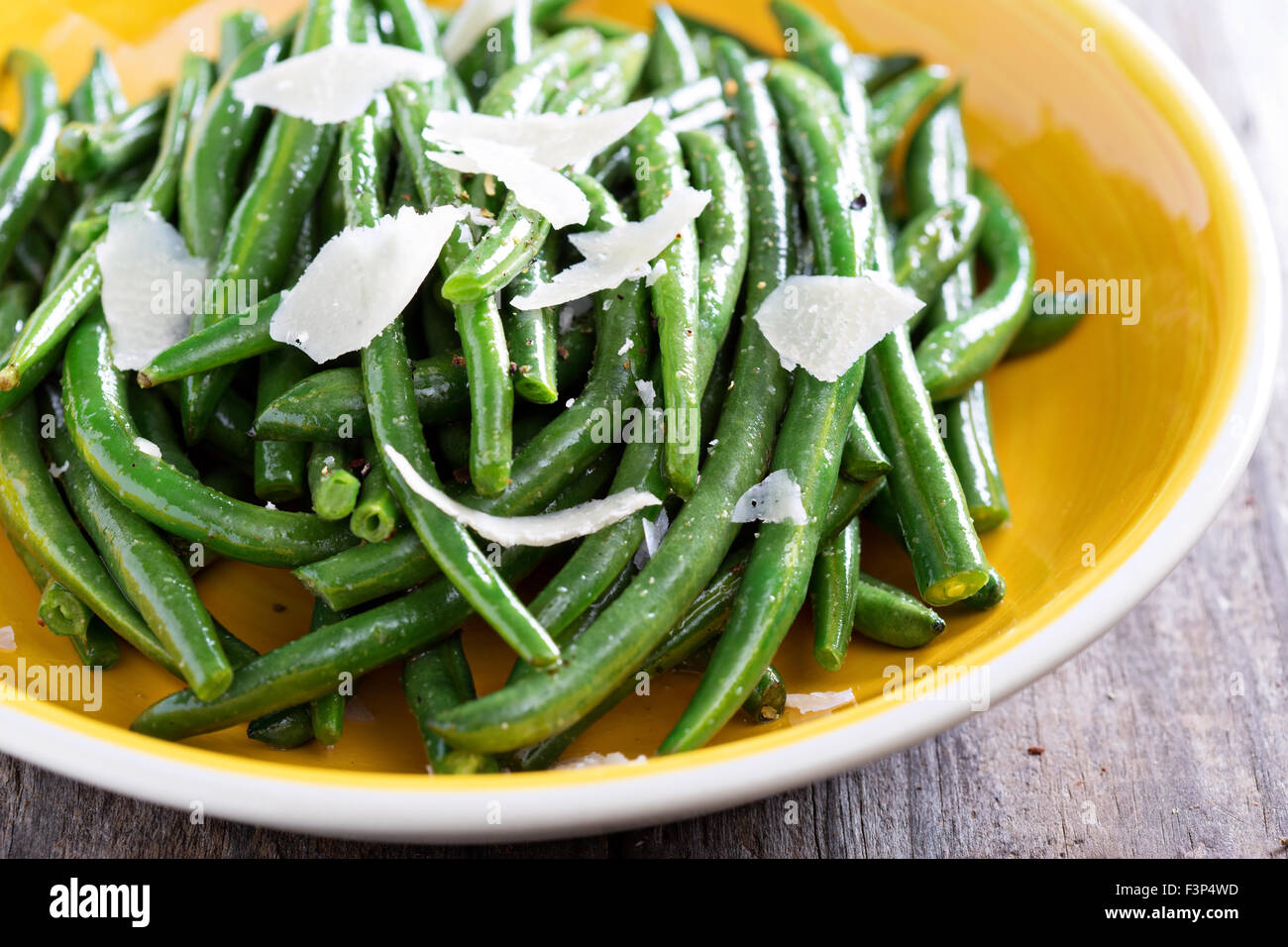 Sauteed green beans with parmesan cheese on big plate Stock Photo Alamy