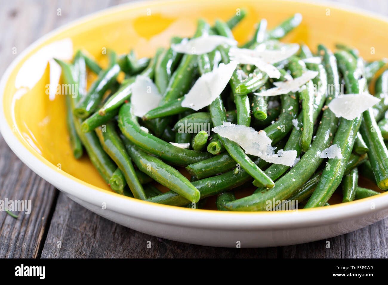 Sauteed green beans with parmesan cheese on big plate Stock Photo Alamy