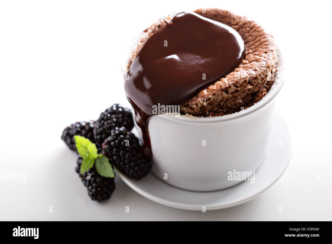 Chocolate souffle with thick chocolate ganache glaze Stock Photo Alamy