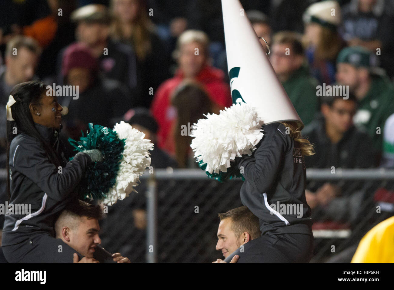 Michigan state cheerleaders in action hires stock photography and