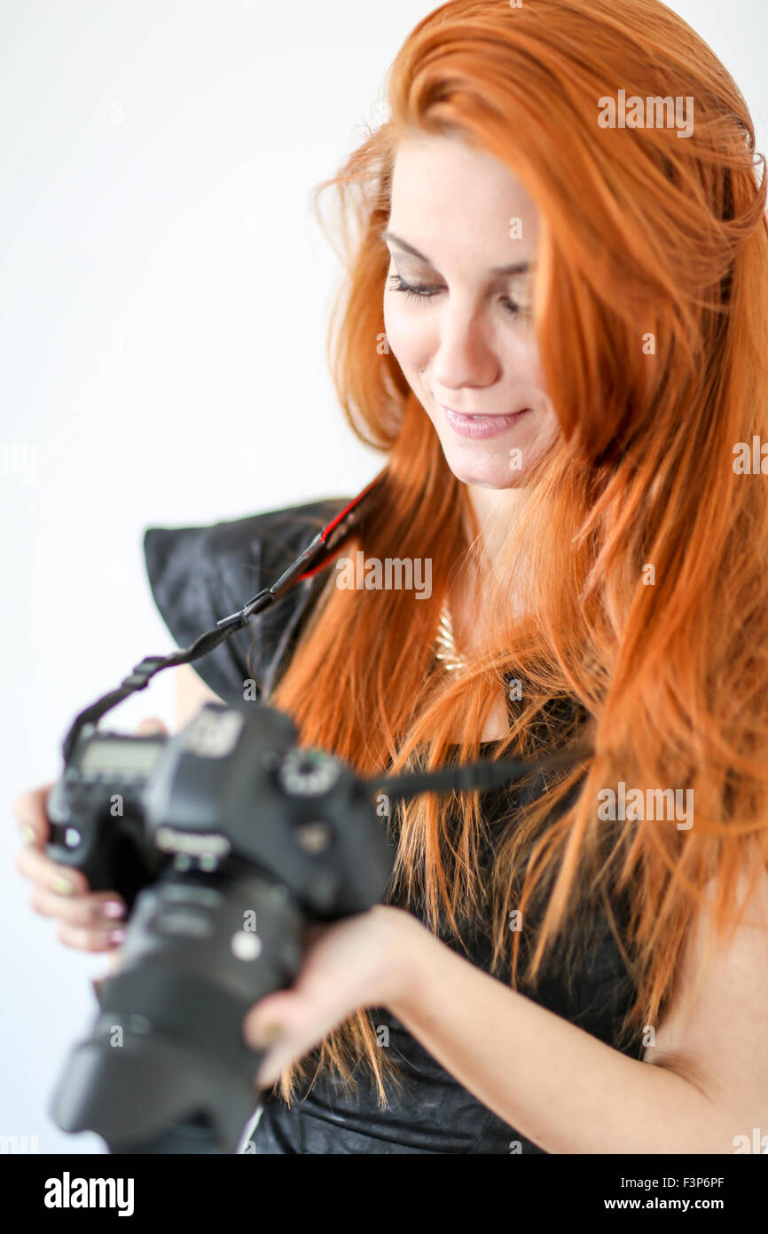 Red hair woman with dslr camera Stock Photo