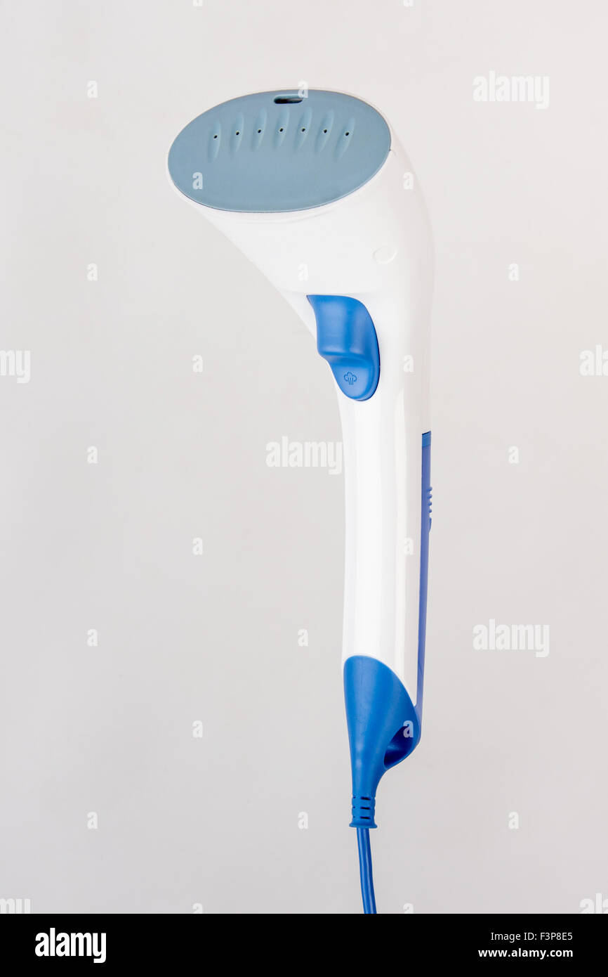 Image hand domestic garment steamer in three quarters, isolated on a