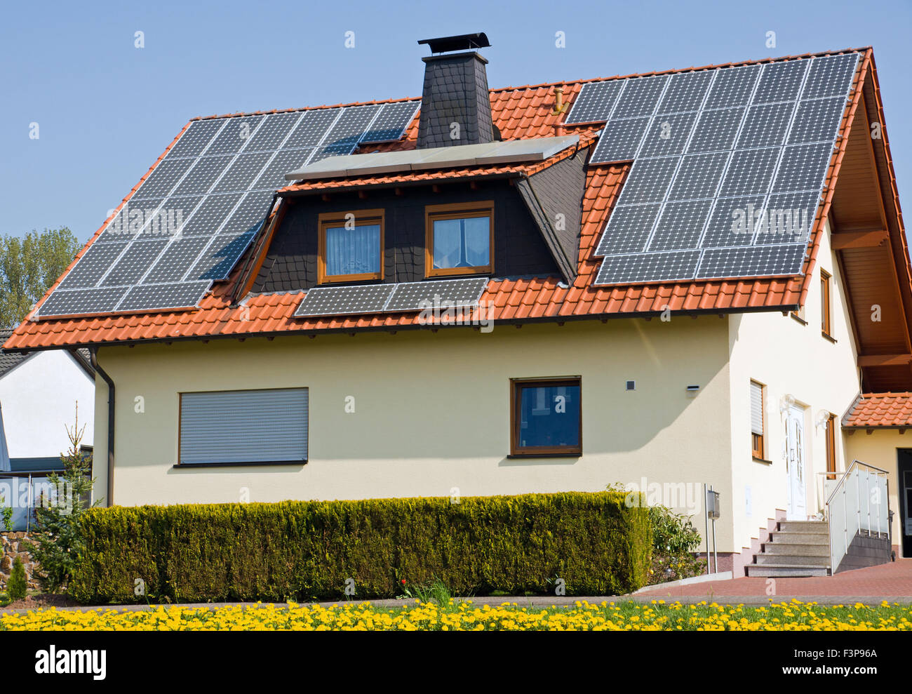 Solar panels on the roof of a single occupancy house Stock Photo