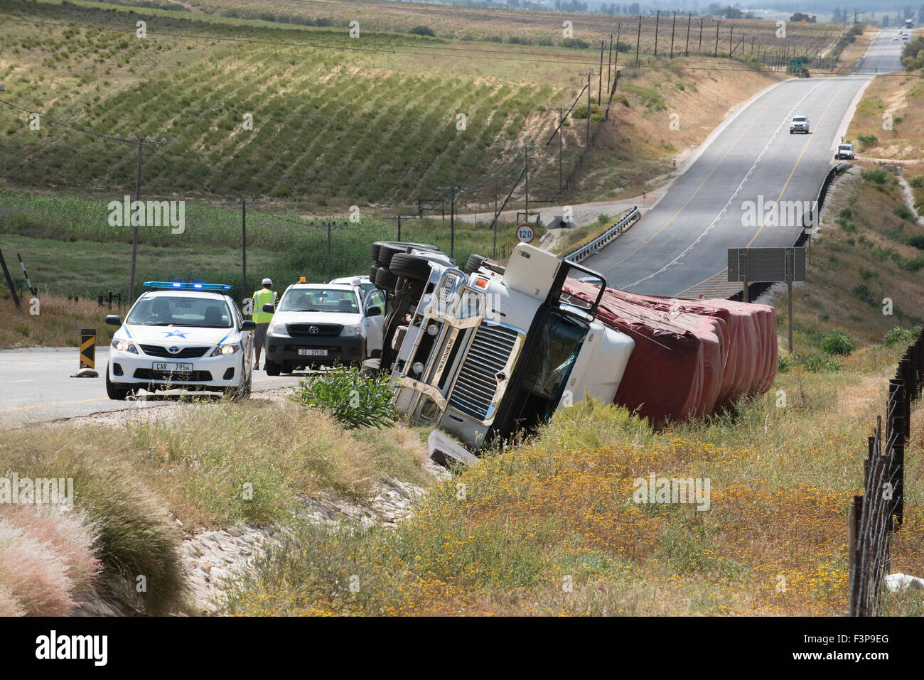 A haulage truck overturned lying in a ditch alongside the Cape Namibian ...