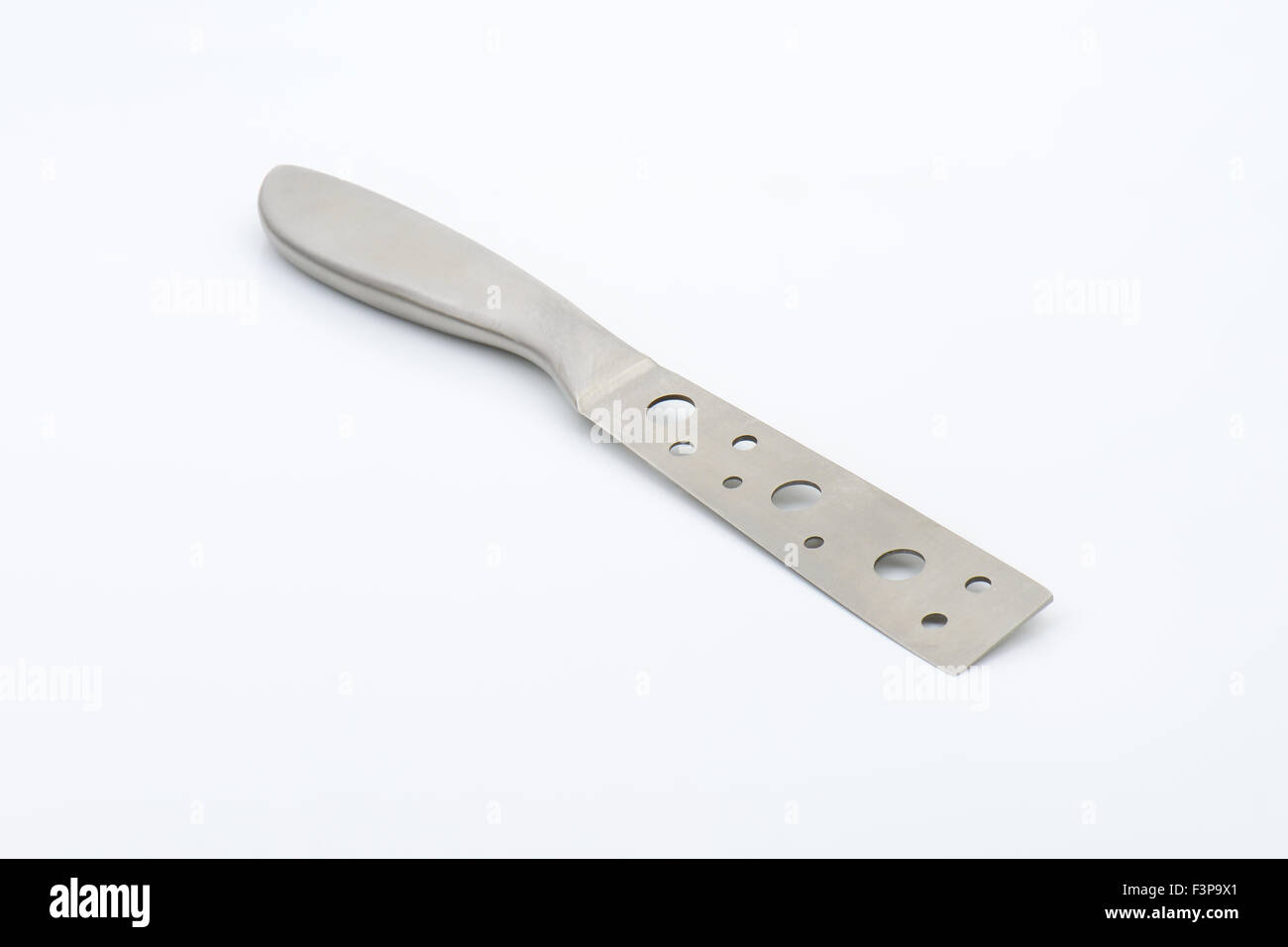 cheese knife with holes on white background Stock Photo Alamy