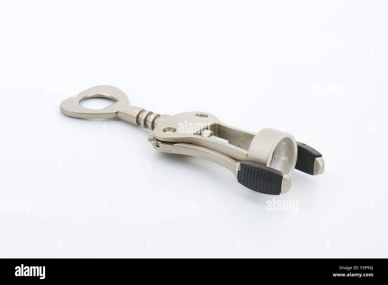 metal bottle opener on white background Stock Photo - Alamy