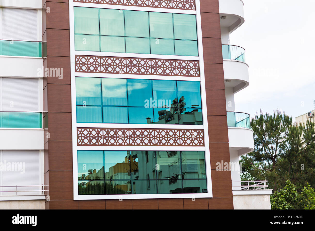 Facade of a building with windows and balconies Stock Photo - Alamy