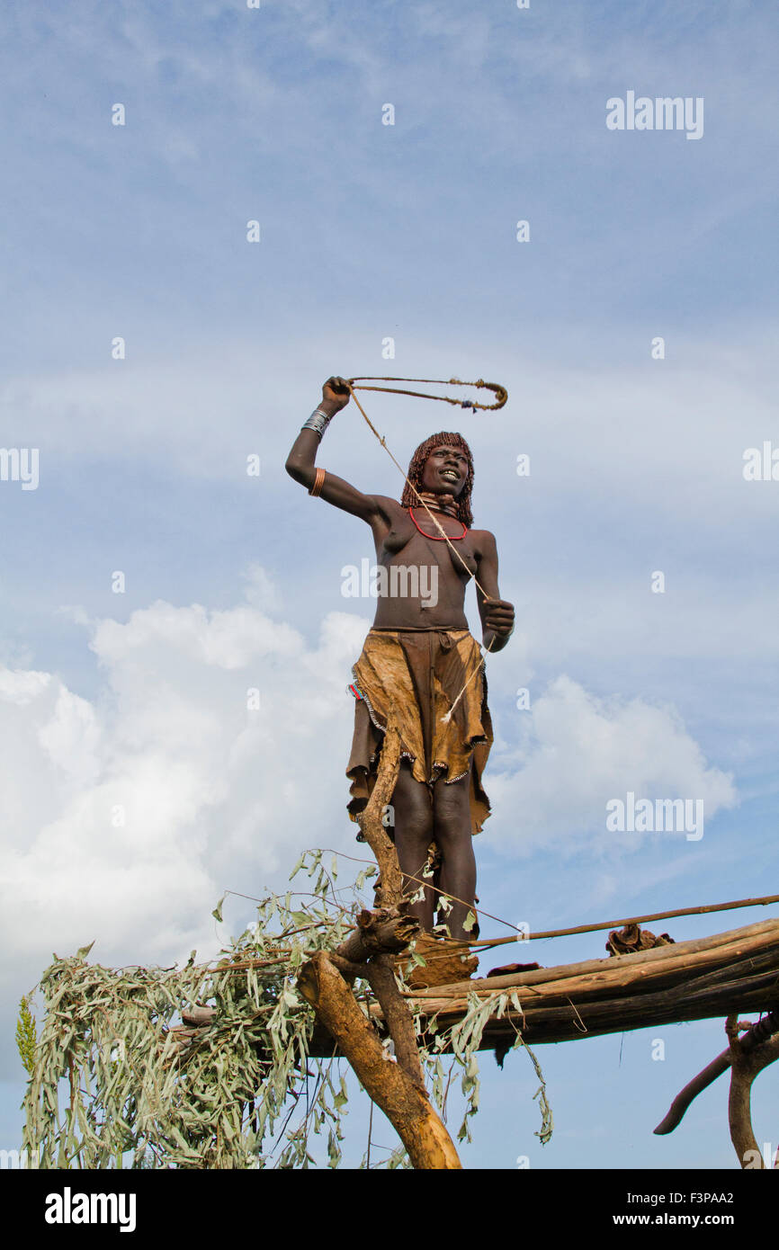 Africa, Ethiopia, Omo River Valley Hamer Tribe woman hunts with a slingshot Stock Photo