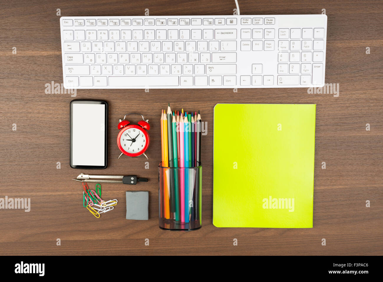 Keyboard with office supplies Stock Photo Alamy