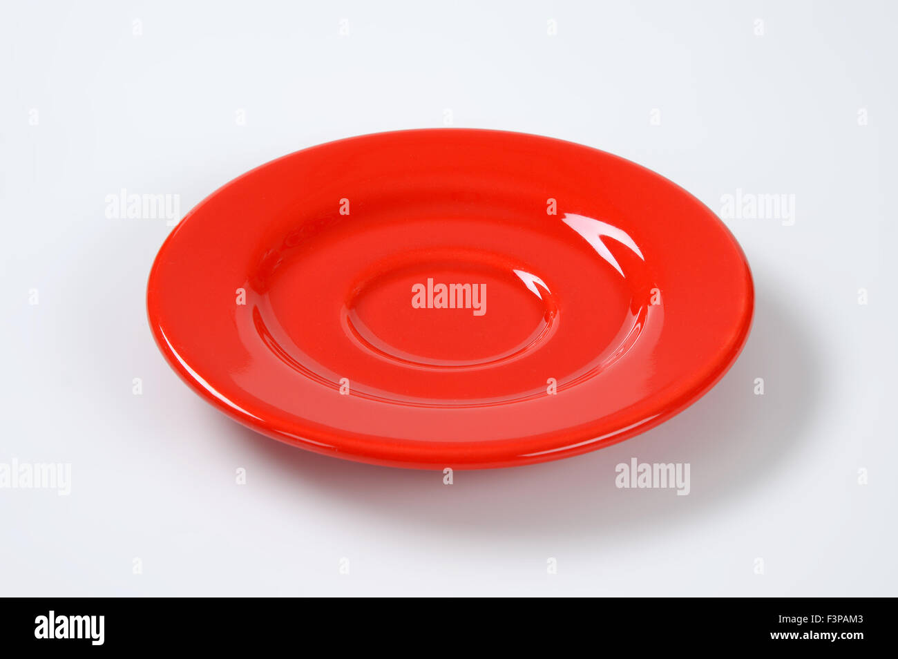 empty red saucer on white background Stock Photo