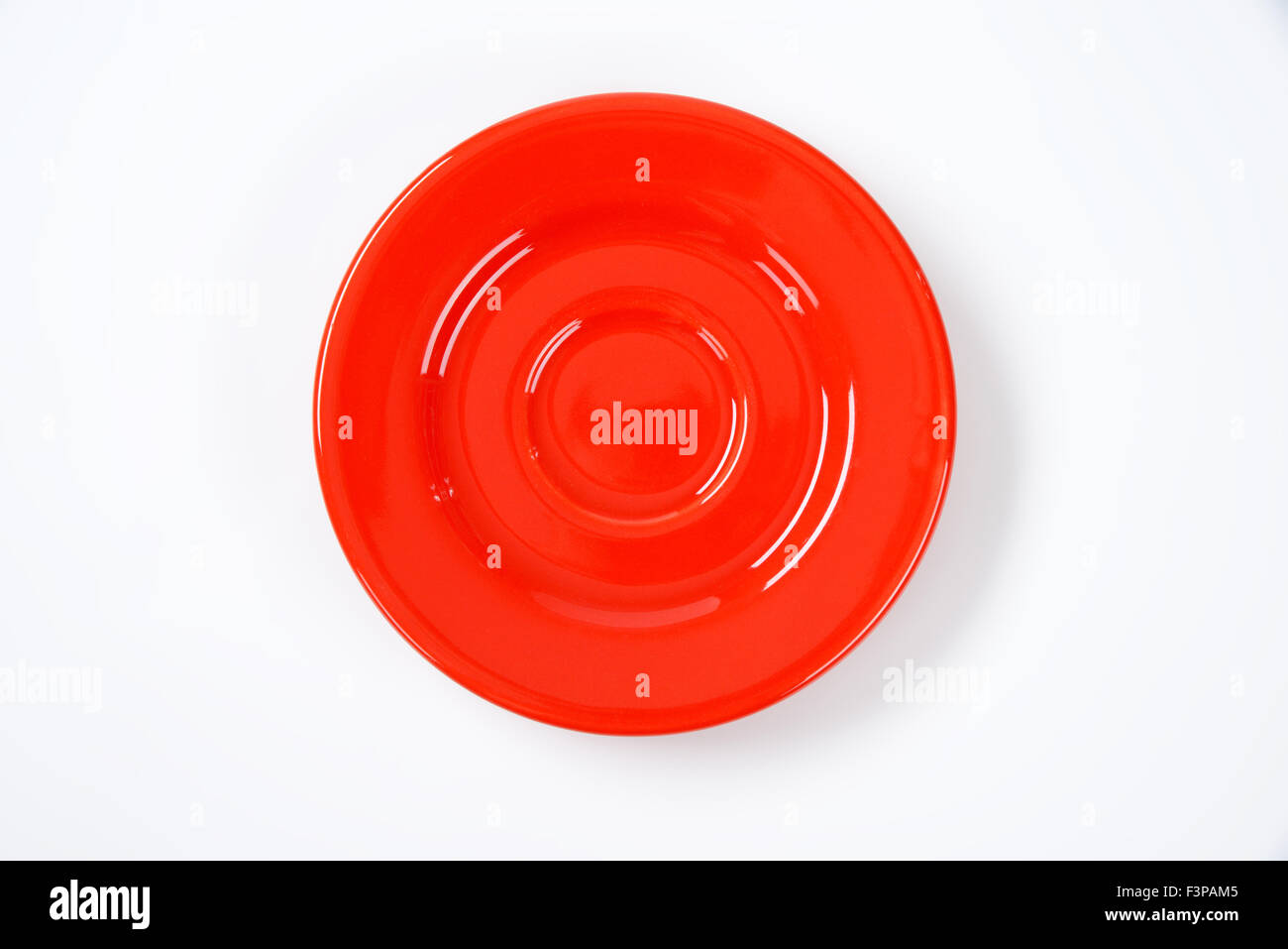 empty red saucer on white background Stock Photo