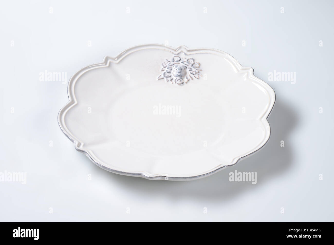 white decorative plate on white background Stock Photo Alamy