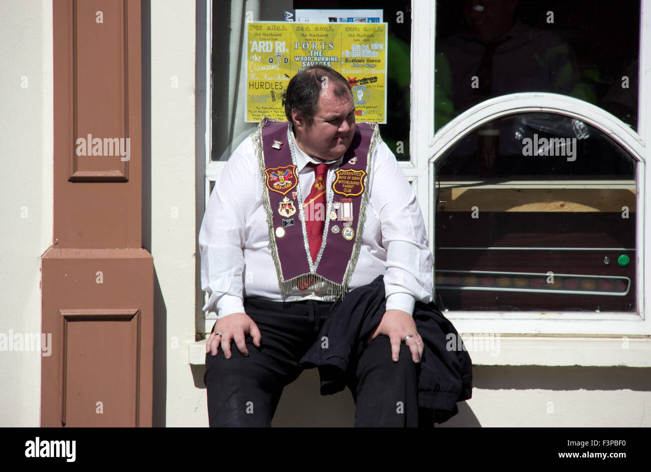 Marcher takes a break at eh Apprentice Boys of Derry parade. Stock Photo
