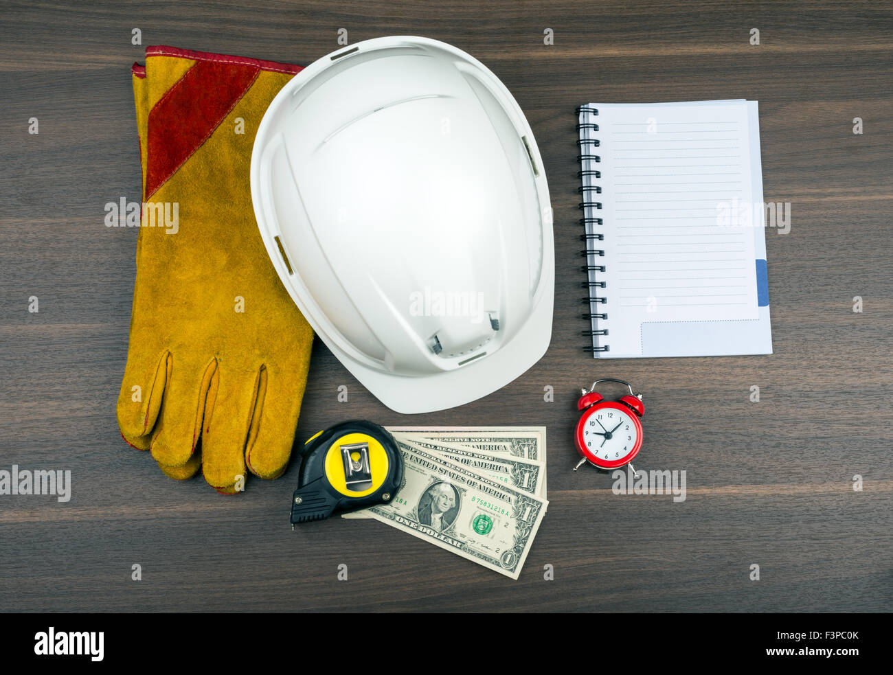 Construction gloves with alarm clock Stock Photo