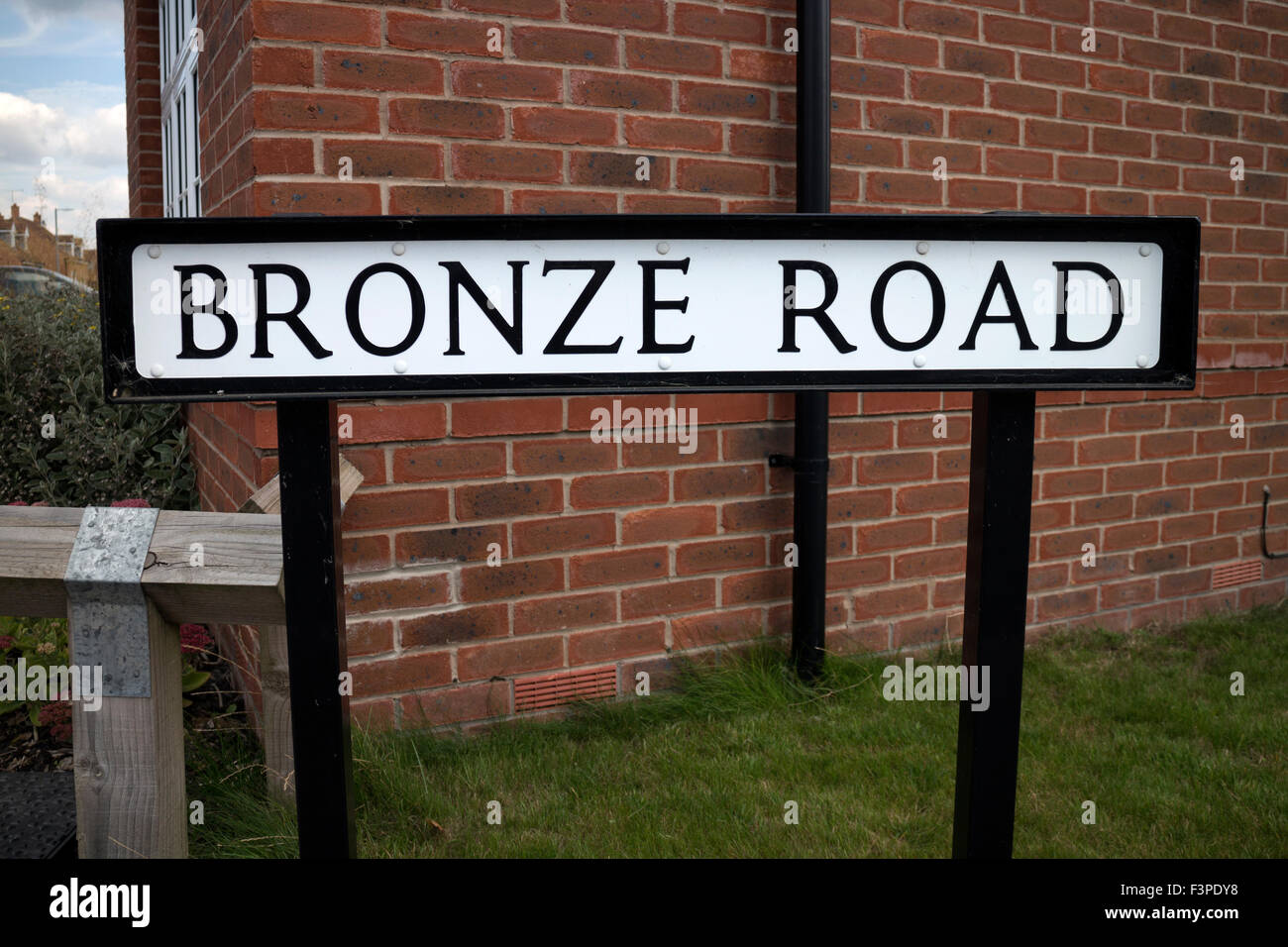 Bronze Road sign in Cawston village, Rugby, Warwickshire, England, UK