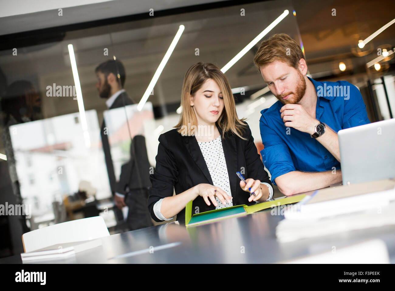 Young people in the office Stock Photo - Alamy