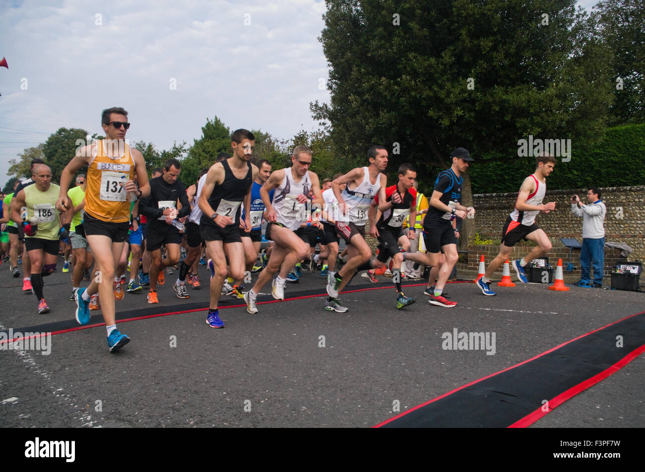 Chichester, West Sussex, England, 11th September 2015. Participants in the Chichester half marathon begin the run in Westgate, Chichester. Credit:  Adam Lack/Alamy Live News Stock Photo