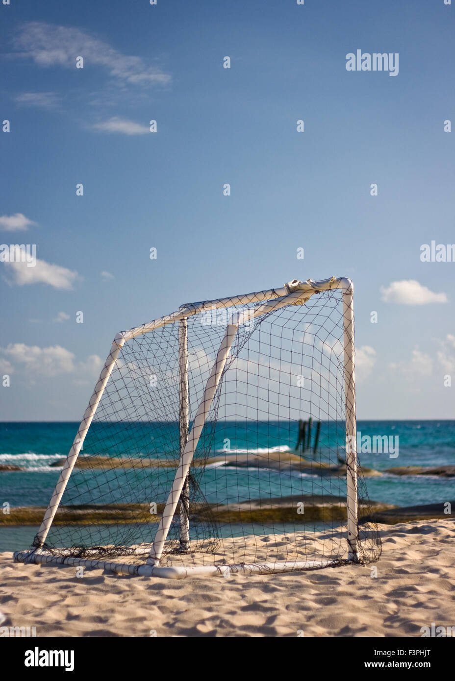 Football goal on beach against blue sky and sea Stock Photo