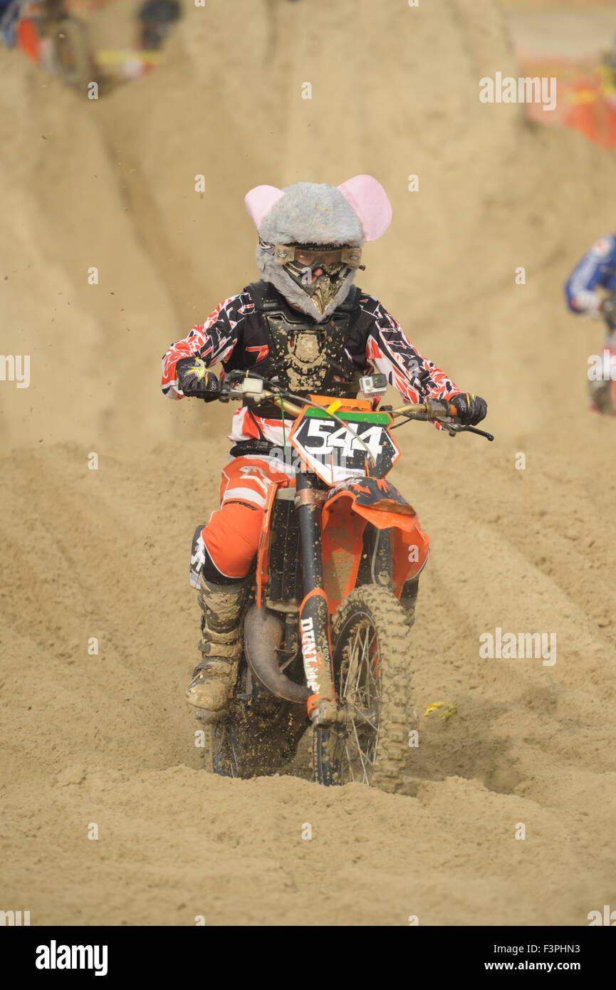 Weymouth, Dorset, UK - 11th October 2015. Annual Lion's Beach motocross weekend on Weymouth Beach.  Weymouth & Portland Lion's  jointly organise the popular event with Purbeck Motocross Club which attracts hundreds of riders, who test themselves on the tricky beach course - A rider who has added mouse ears to his helmet - Picture: Graham Hunt/Alamy Live News Stock Photo