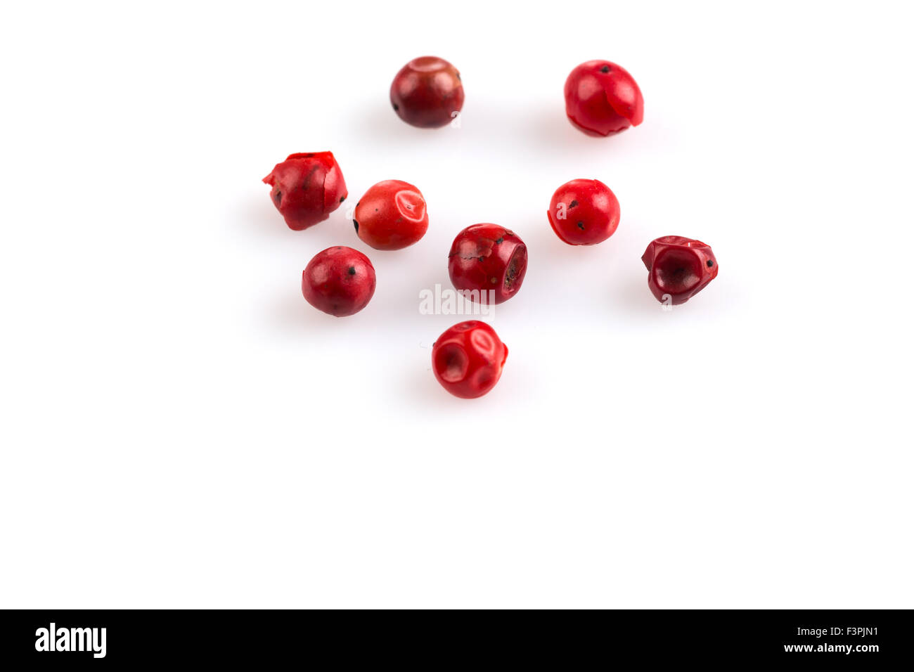 red peppercorns seeds isolated on white background Stock Photo Alamy
