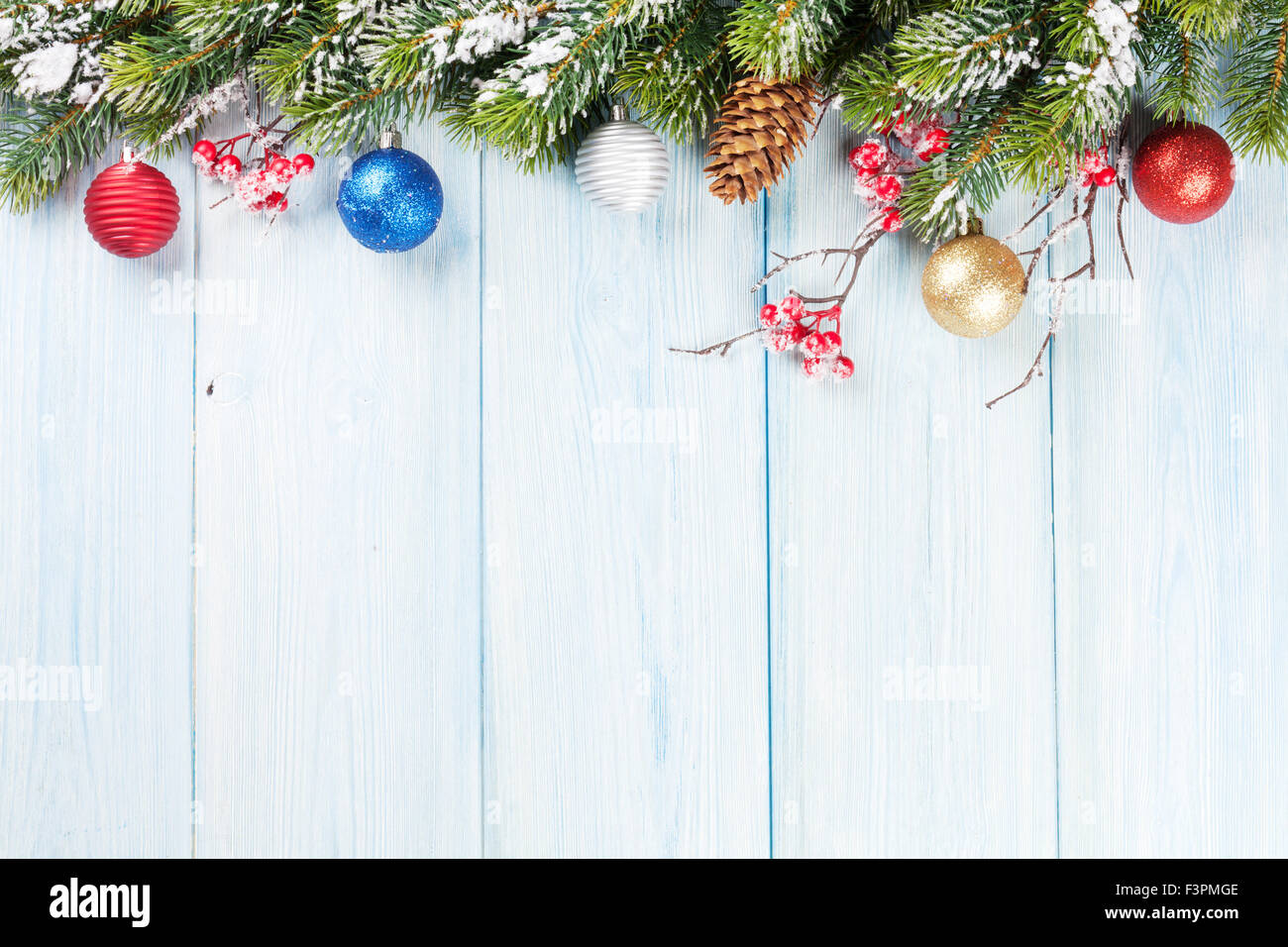 Christmas wooden background with snow fir tree and decor. View with ...