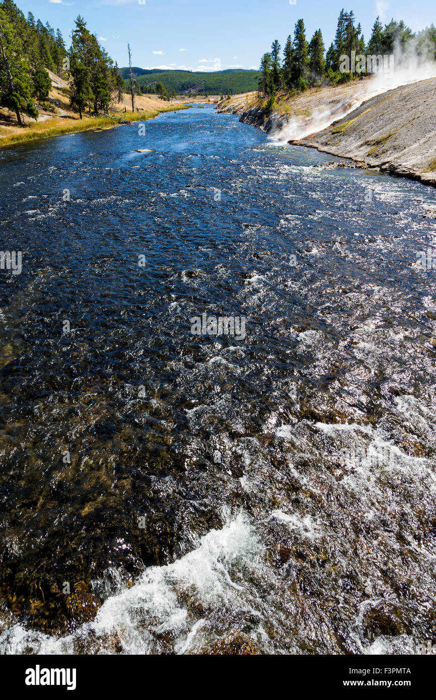 Midway Geyser Basin; hot springs flow to Firehole River; Yellowstone National Park, Wyoming, USA Stock Photo