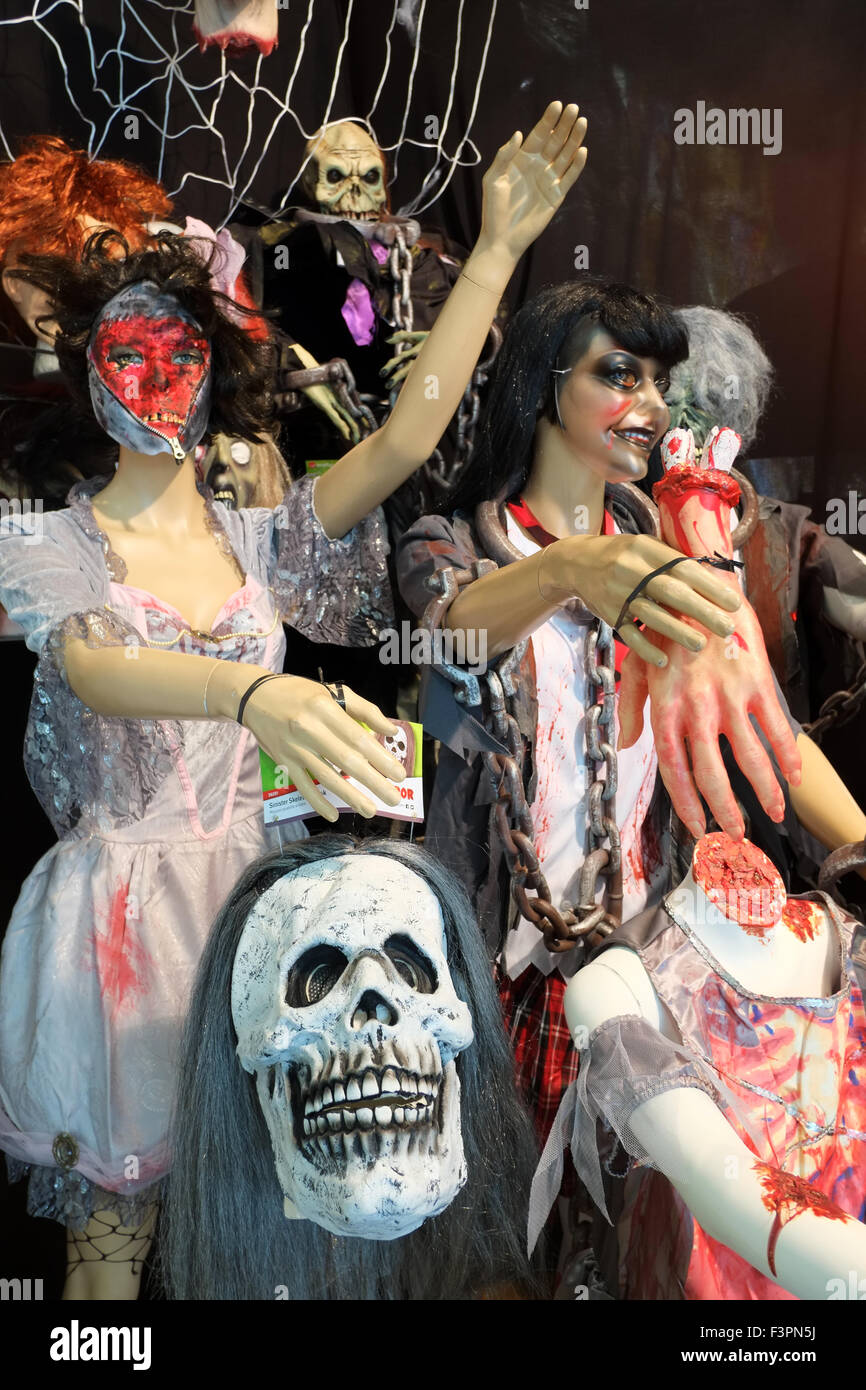 Halloween costumes & masks on display with seasonal offers for sale Stock Photo - Alamy