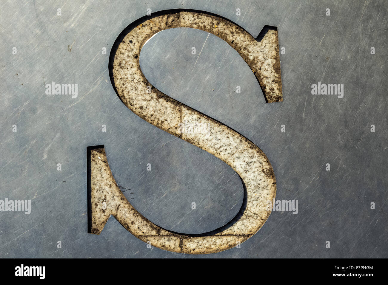 letter S cut in the metal sheet Stock Photo
