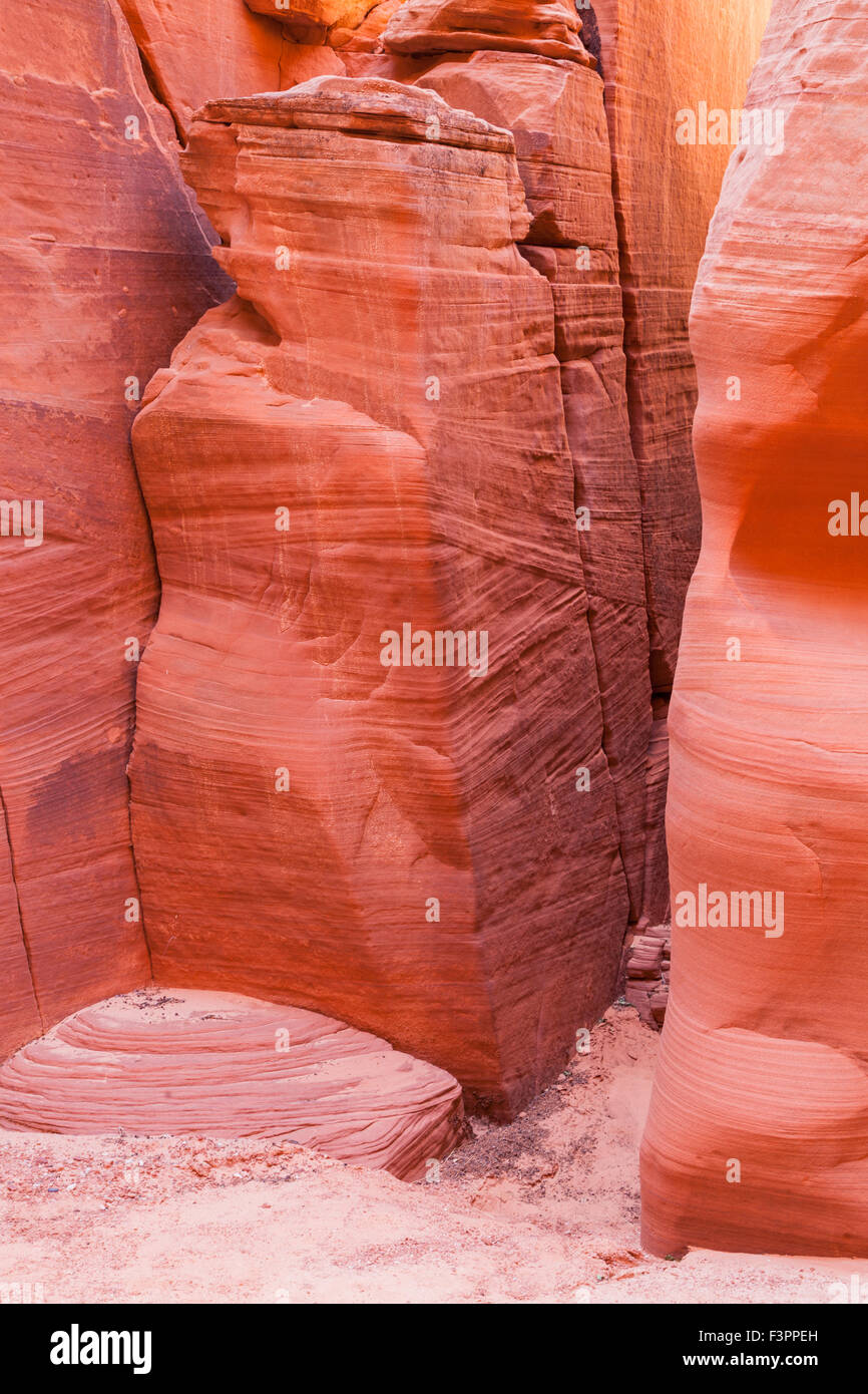 Colorful ancient sandstone walls eroded by time and water to create smooth layers in Canyon X in Page, Arizona. Stock Photo