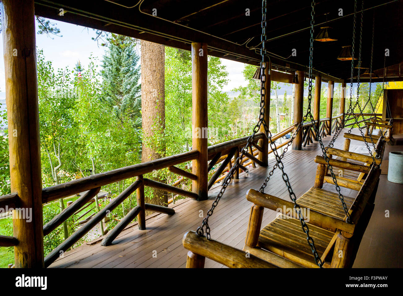 View from porch & wooden swing seats; historic Grand Lake Lodge; near Rocky Mountain National Park; Colorado; USA Stock Photo