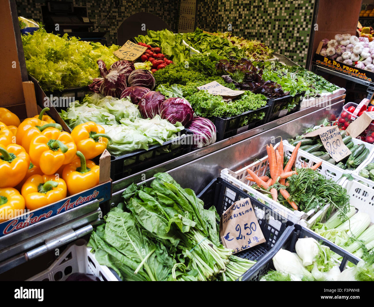 Italy, Emilia-Romagna region, Bologna - market food sellers. Fruit and vegetable market. Salad crops. Stock Photo